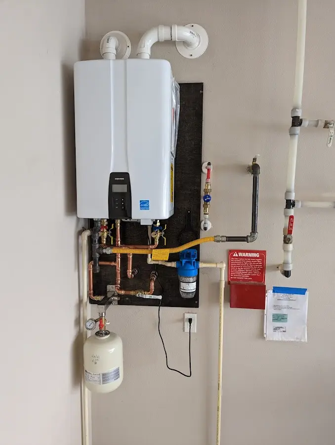 Professional plumber installing copper piping in a Mount Healthy Heights home